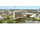 Ramada Plaza aerial view showing the hotel exterior and the pool, with a bridge to a lake at 6165 Carrier Dr # 1309, Orlando, FL 32819