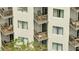 Exterior shot of multi-level condo balconies with seating and railings, providing private outdoor spaces at 6165 Carrier Dr # 1309, Orlando, FL 32819