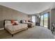 Bedroom features two queen beds, sliding glass doors to balcony, textured wall, and desk at 6165 Carrier Dr # 1309, Orlando, FL 32819
