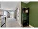 Open floor plan from kitchen to bedroom with sliding glass doors to a balcony and a mirrored closet at 6165 Carrier Dr # 1309, Orlando, FL 32819