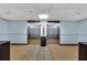 Hallway featuring carpeted floors, two elevators and a trash can between them at 6165 Carrier Dr # 1309, Orlando, FL 32819