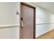 Hallway featuring carpeted floors and a door to unit 1309 with an electronic door lock at 6165 Carrier Dr # 1309, Orlando, FL 32819
