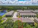 Aerial view of townhomes, showcasing the property and surrounding trees and community at 67 Bella Oaks Dr, Port Orange, FL 32129