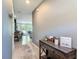 Inviting hallway with neutral paint and tile flooring leading to a well-lit open concept living space at 67 Bella Oaks Dr, Port Orange, FL 32129