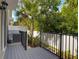 Private outdoor patio with a metal fence and lush greenery, perfect for relaxation at 67 Bella Oaks Dr, Port Orange, FL 32129