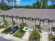 Street view of townhomes featuring garages, landscaping, and well-maintained sidewalks at 67 Bella Oaks Dr, Port Orange, FL 32129