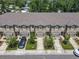 Street view of townhomes featuring garages, landscaping, and well-maintained sidewalks at 67 Bella Oaks Dr, Port Orange, FL 32129