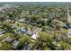 Aerial view of the property at 1616 Huntington St in a residential neighborhood with green trees at 1616 Huntington St, Lakeland, FL 33801