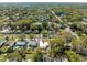 Aerial view of property at 1616 Huntington St, nestled in a lush, green, tree-lined neighborhood at 1616 Huntington St, Lakeland, FL 33801