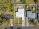 An aerial view shows the backyard, fence, and driveway of the home at 1616 Huntington St, Lakeland, FL 33801