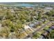 An aerial view shows the location of the house and neighborhood with lake in the background at 1616 Huntington St, Lakeland, FL 33801