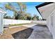 Spacious backyard with a white fence and mulch areas creating a relaxing outdoor space at 1616 Huntington St, Lakeland, FL 33801
