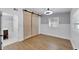Bedroom with barn door, modern ceiling fan, and stylish wallpaper at 1616 Huntington St, Lakeland, FL 33801