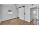 Bedroom showcases wood-look floors, ceiling fan, and sliding closet doors at 1616 Huntington St, Lakeland, FL 33801