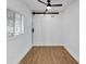 Cozy bedroom with a ceiling fan and a unique sliding barn door at 1616 Huntington St, Lakeland, FL 33801