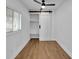 Clean bedroom boasts built-in shelving and a modern sliding barn door at 1616 Huntington St, Lakeland, FL 33801