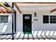 Charming home's front entrance features a stylish green door and clearly marked address at 1616 Huntington St, Lakeland, FL 33801