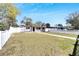 Charming single story home featuring a lush lawn and white picket fence at 1616 Huntington St, Lakeland, FL 33801