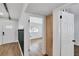 Hallway offering a glimpse into a bedroom, showcases wood flooring at 1616 Huntington St, Lakeland, FL 33801
