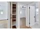 Hallway showing a closet and views into a bedroom and a bathroom at 1616 Huntington St, Lakeland, FL 33801