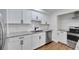 Kitchen featuring white cabinets, granite countertops, stainless steel appliances, and a stainless steel sink at 1616 Huntington St, Lakeland, FL 33801