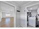 Hallway view of bright laundry room with a washer and dryer at 1616 Huntington St, Lakeland, FL 33801