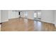 Open-concept living area featuring wood flooring and glass doors at 1616 Huntington St, Lakeland, FL 33801