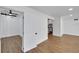 Bright living room featuring hardwood floors and an open doorway to another room at 1616 Huntington St, Lakeland, FL 33801