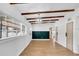 Inviting open space with modern lighting, a sleek accent wall and lovely wood floors at 1616 Huntington St, Lakeland, FL 33801