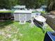 Aerial view of a backyard featuring a shed, chicken coop and a boat on a trailer at 1841 Talmadge St, Deland, FL 32724