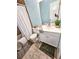Well-lit bathroom featuring a shower/tub combination, toilet, and vanity with ample counter space at 1841 Talmadge St, Deland, FL 32724