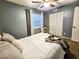 Inviting bedroom featuring a ceiling fan, window, and a cozy bed with closet at 1841 Talmadge St, Deland, FL 32724