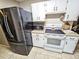 Kitchen with refrigerator, stove, and ample cabinet space at 1841 Talmadge St, Deland, FL 32724