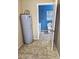 View of the laundry room featuring tile floors, washer and dryer hookups, and access to an adjacent blue-walled bathroom at 1841 Talmadge St, Deland, FL 32724