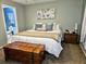 Bedroom with large bed, wooden chest, and calming wall color at 1841 Talmadge St, Deland, FL 32724