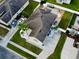 Well-manicured lawn and attractive hardscape in rear with parking for two vehicles in the driveway at 2864 Running Brook Cir, Kissimmee, FL 34744