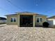 Paver patio and enclosed lanai offer outdoor living space and relaxation at 2864 Running Brook Cir, Kissimmee, FL 34744