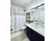 Clean, well-lit bathroom featuring a sink, toilet, and shower/tub combo at 2864 Running Brook Cir, Kissimmee, FL 34744