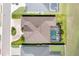Aerial view of the property, highlighting its layout, pool, and manicured landscaping at 3249 Pearly Dr, Lakeland, FL 33812
