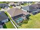 Aerial view of the property with a private screened-in pool, enhancing backyard enjoyment at 3249 Pearly Dr, Lakeland, FL 33812
