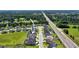 Aerial view highlighting the property's location, set amongst lush greenery and easy access to the highway at 3249 Pearly Dr, Lakeland, FL 33812