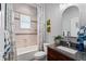 Well-lit bathroom features a granite countertop, framed mirror, bathtub, and patterned shower curtain at 3249 Pearly Dr, Lakeland, FL 33812
