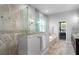 Elegant bathroom featuring a glass enclosed shower, tub, and upscale fixtures with granite countertops at 3249 Pearly Dr, Lakeland, FL 33812