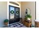 Elegant double-door entryway adorned with wreaths, complemented by stylish decor and a welcoming rug at 3249 Pearly Dr, Lakeland, FL 33812
