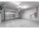Clean, well-lit two car garage featuring an insulated garage door and electric vehicle charger at 3249 Pearly Dr, Lakeland, FL 33812