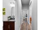 Hallway featuring a bathroom with a granite countertop, a plant, and a view of a study desk at 3249 Pearly Dr, Lakeland, FL 33812