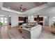 Spacious open concept living room with hardwood floors connecting to a modern kitchen at 3249 Pearly Dr, Lakeland, FL 33812