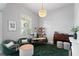 Bright home office featuring stylish decor, a work desk, and comfortable seating area with a plush rug at 3249 Pearly Dr, Lakeland, FL 33812