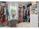 Walk-in closet with custom shelving, drawers, and a vanity area at 3249 Pearly Dr, Lakeland, FL 33812