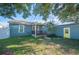Home exterior showcasing a charming backyard, deck and shed with a yellow door at 549 Palencia Pl, Lakeland, FL 33803